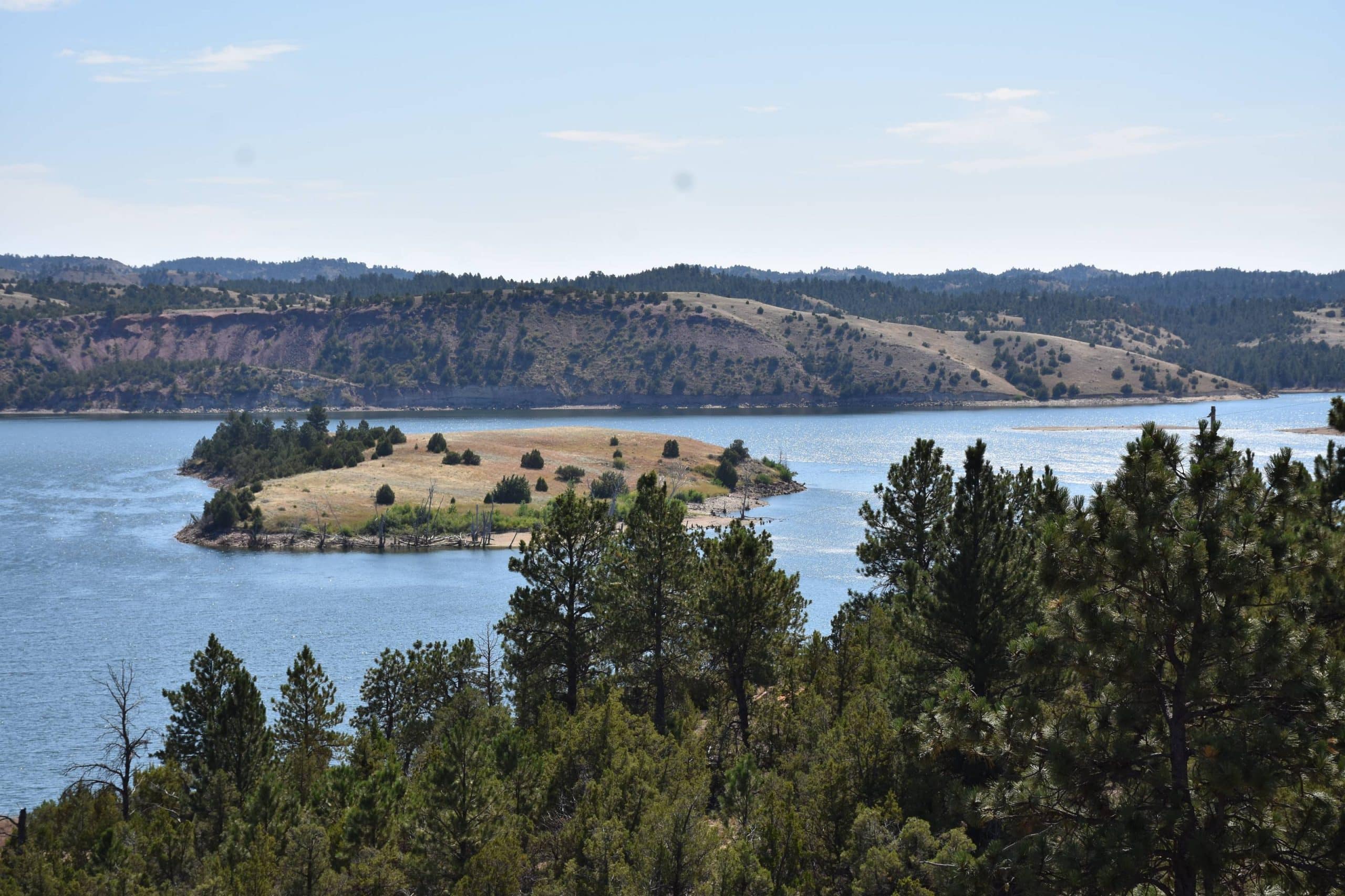 Tongue river reservoir state park landscape with large river and big evergreen trees